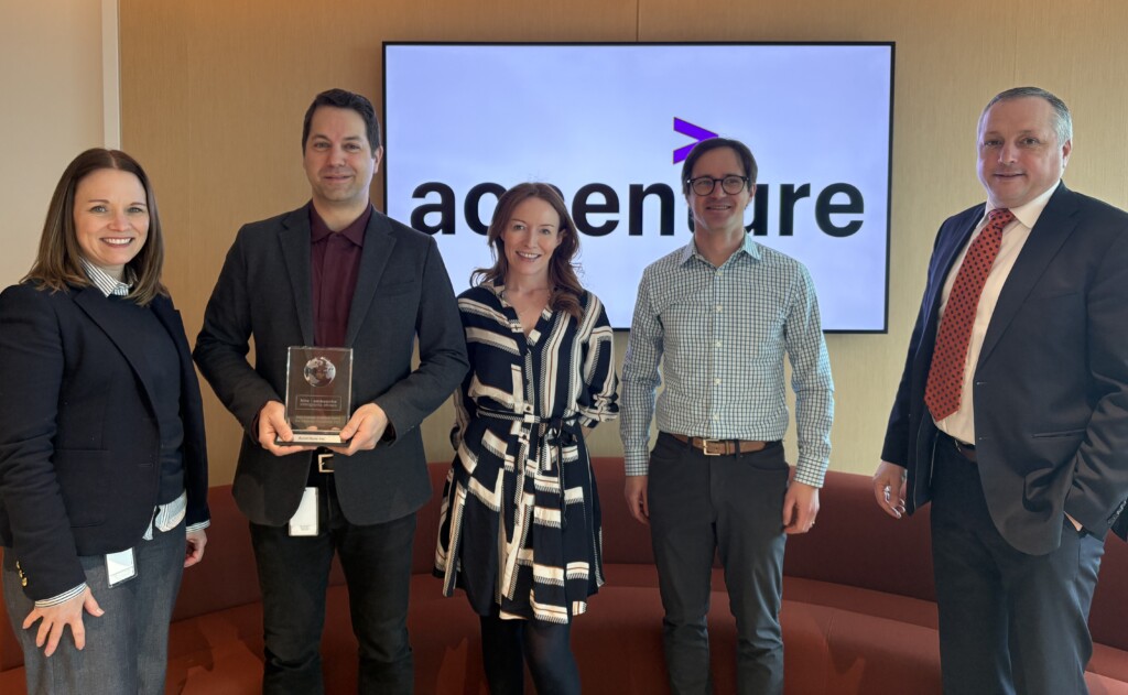 Five Accenture employees holding the 2025 HIO Employer Excellence Awards Crystal.